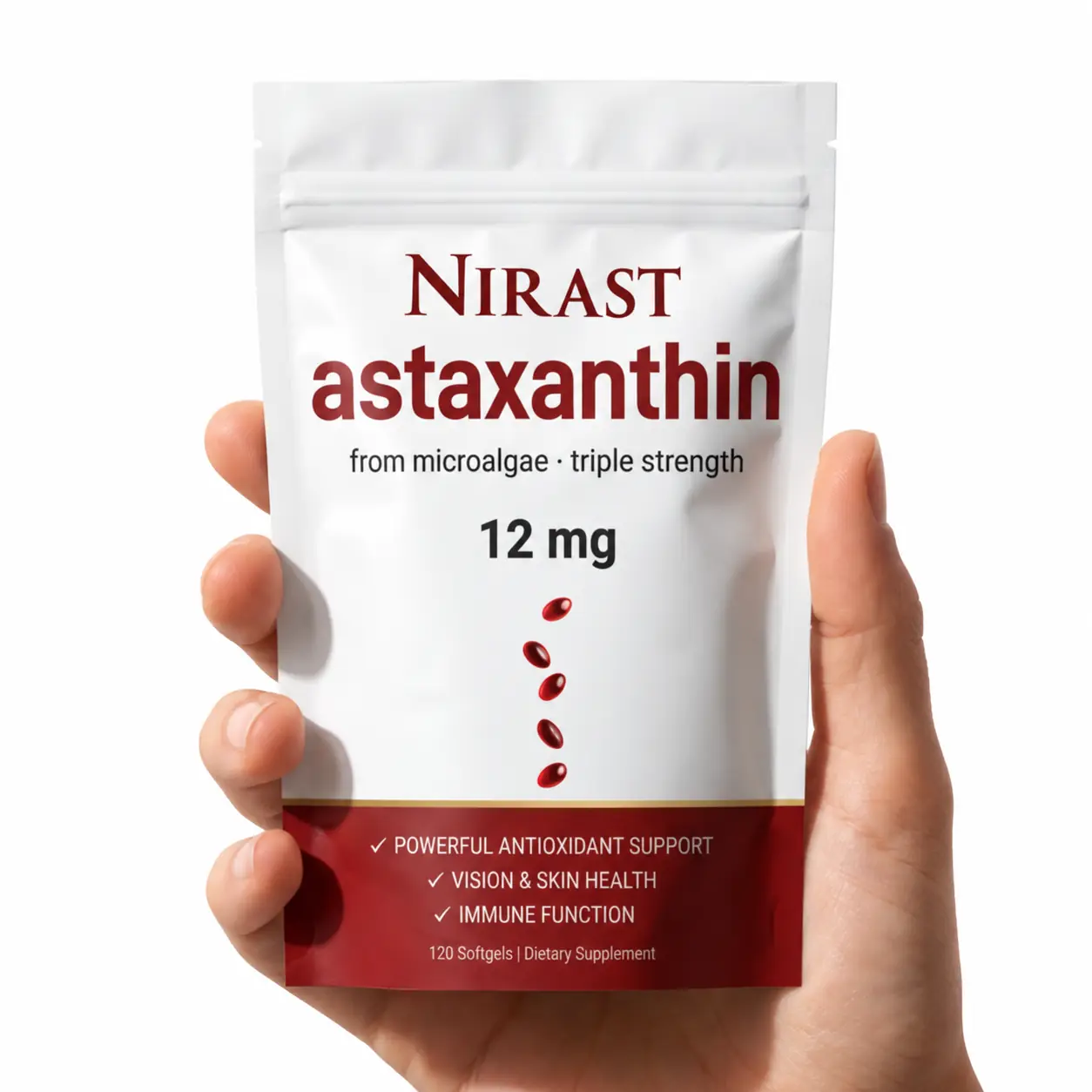 Hand holding a package of Nirast astaxanthin supplement, 12 mg.